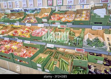 Fruit vegetables, large selection of colorful vegetables in boxes displayed on supermarket shelves, gruken, zucchini, peppers, eggplants, shop, fresh Stock Photo