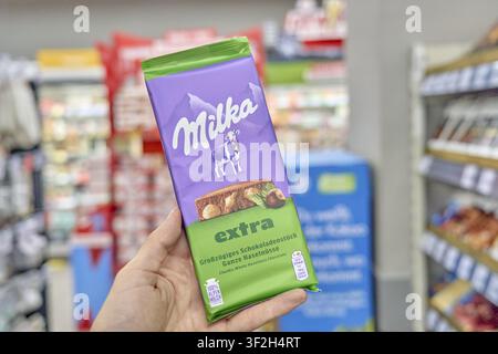 Milka Extra chocolate with hazelnuts on the shelf of a supermarket, chocolate, product, Kaufland, supermarket, Germany Stock Photo