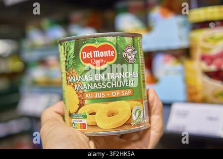 A can of pineapple sliced by Del Monte is kept in the supermarket, product from Rewe Markt food retail, food retail Stock Photo