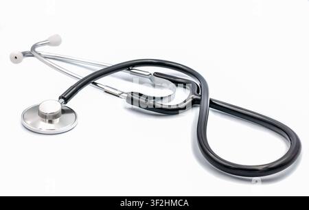 Black medical stethoscope isolated on clean white studio background Stock Photo