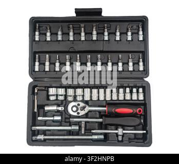 An open black plastic case filled with a comprehensive socket wrench set, bits, hex keys, and ratchet handle Stock Photo