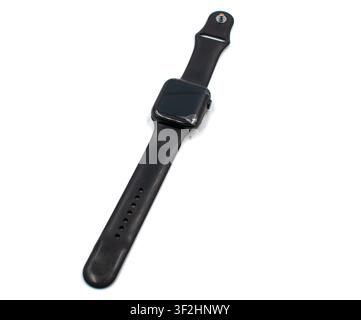 Broken smartwatch with cracked glass screen on white background Stock Photo