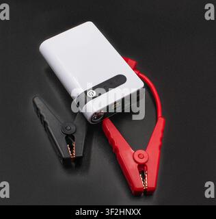 Portable car jump starter power bank with jumper cables Stock Photo