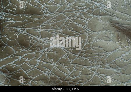 Elegant olive green jacquard fabric with abstract white branch pattern. Perfect for luxury interior and textile design. Stock Photo