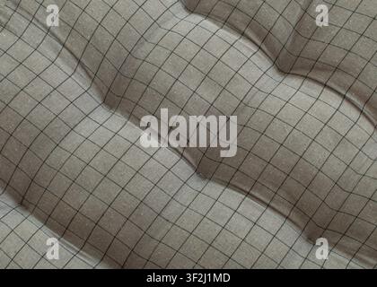 Soft gray tufted fabric with classic black grid pattern. Great for sofa, chair, and bedding texture backgrounds. Stock Photo