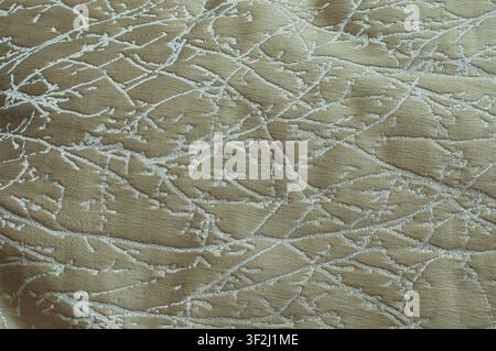 Elegant olive green jacquard fabric with abstract white branch pattern. Perfect for luxury interior and textile design. Stock Photo