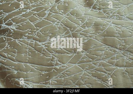 Elegant olive green jacquard fabric with abstract white branch pattern. Perfect for luxury interior and textile design. Stock Photo
