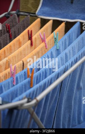 Clothes drying on a line in an outdoor setting Stock Photo