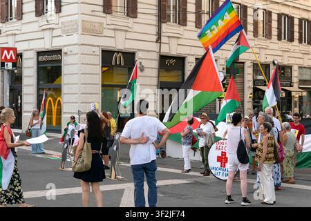 Demonstrators gather near a Palestinian flag during a protest in Lyon ...