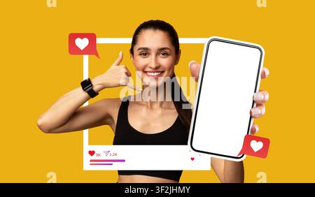 Smiling Young Asian Woman Holding Smartphone And Making Call Gesture, Gym Setting, Technology Concept Stock Photo