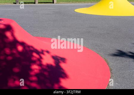 Abstract view of red and yellow geometric shapes in a park Stock Photo
