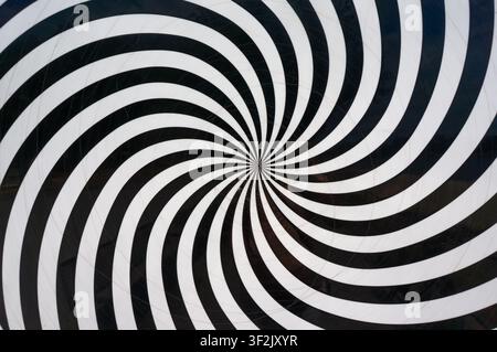 hypnotic black and white spiralswirl illusion Stock Photo