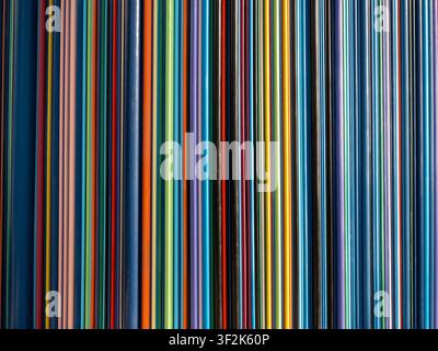 Vibrant multicolored abstract background texture featuring tightly packed parallel vertical straight lines in bright rainbow colors for modern design Stock Photo