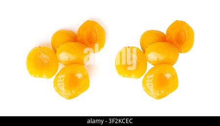 Canned Peaches Pile Isolated, Apricot Halves in Syrup, Yellow Fruit Dessert, Tinned Nectarine Compote, Orange Peeled Peache Slices on White Background Stock Photo