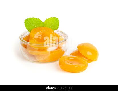Canned Peaches in Bowl Isolated, Apricot Halves in Syrup, Yellow Fruit Dessert, Tinned Nectarine Compote, Orange Peeled Peache Slices on White Backgro Stock Photo