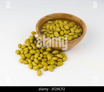 Edamame beans bowl isolated. Green soy bean pile, cooked young soybean, boiled Japanese pea on white background Stock Photo