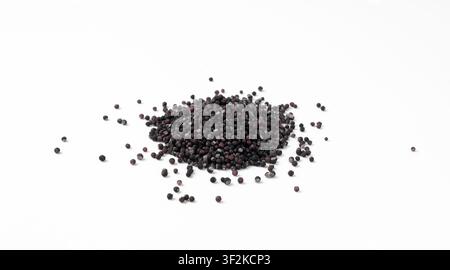 Candy black sprinkle pile, round sugar sprinkles isolated, sweet color confectionery decoration, many small sugar balls on white background Stock Photo