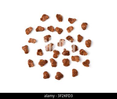 Chocolate cereal flakes isolated, rice crispy breakfast. Corn and choco cornflakes pile, breakfast caramel cereal pops close up on white background to Stock Photo