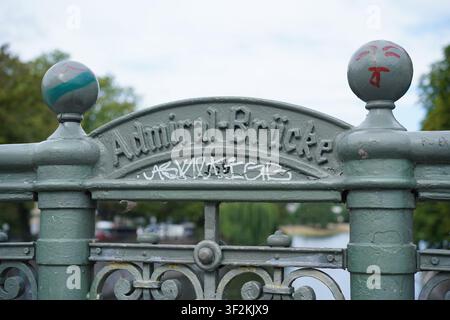 Berlin, Germany - July 19, 2026: Close-up of the historic cast iron railing with name lettering and graffiti tags on Admiralbrücke in Kreuzberg. Stock Photo