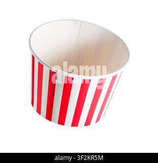 Red and white striped paper bucket for popcorn isolated on white. Simple, classic design suggests fun or festive use. Ideal for popcorn, candy, or des Stock Photo