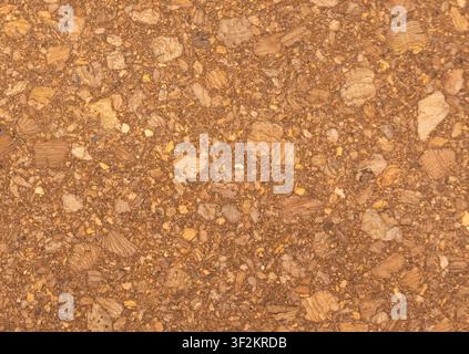 Cork board textured background, blank corkboard pattern. Natural wooden material for pin notice, dark brown noticeboard surface bg with selective focu Stock Photo