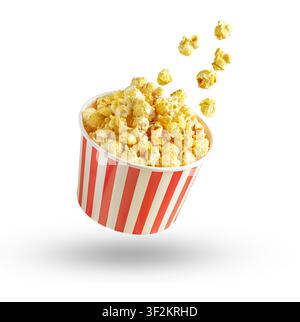 Popcorn flying out of red white striped paper box isolated on white background. Splash, levitation of popcorn grains. Stock Photo