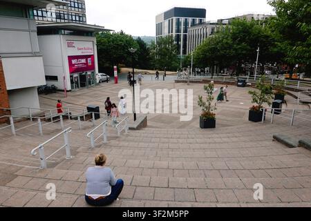 Pedestrians walking down the stone steps of Hallam Square by Sheffield Hallam University in Sheffield city centre, South Yorkshire, England, UK. Stock Photo