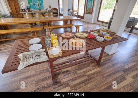 Breakfast buffet served in dining room of rural accommodation. Stock Photo