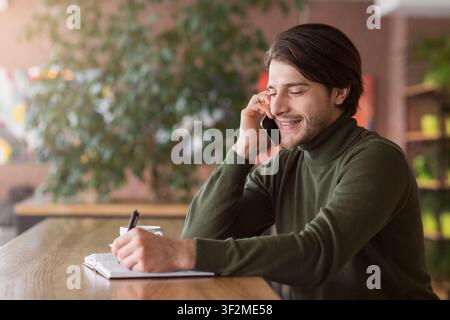 Positive financial advisor talking to business clients on phone Stock Photo