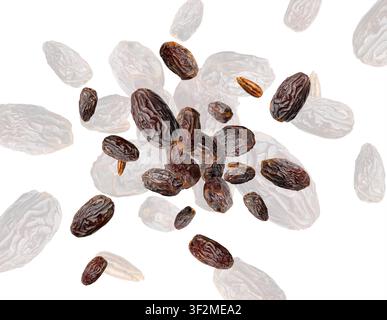 Big dates isolated. Dry date fruits falling, medjool, medjoul or majhool flying, royal dates on white background Stock Photo