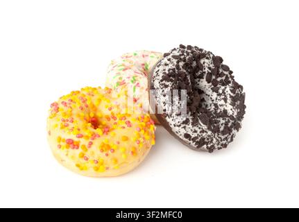 Doughnuts Pile Isolated, Chocolate Brown, Yellow and Pink Donuts, Donuts Stack with Multicolored Sprinkles, Doughnuts on White Background Stock Photo