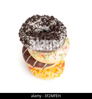 Doughnuts Pile Isolated, Chocolate Brown, Yellow and Pink Donuts, Donuts Stack with Multicolored Sprinkles, Doughnuts on White Background Stock Photo