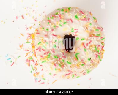 Yellow Doughnuts Isolated, Glazed Frosted Donuts with Colorful Sprinkles, Circle Cake Doughnuts on White Background Stock Photo