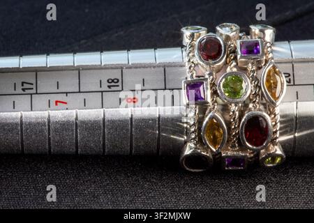 Vintage sterling silver multi-stone statement ring on sizing mandrel Stock Photo