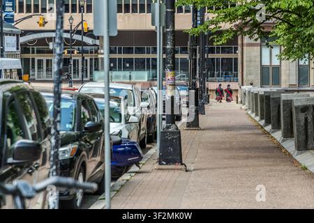 Two men wearing kilts and tartan sashes on a pavement in the city centre of Halifax, Nova Scotia, Canada. Halifax, Nova Scotia, Canada Stock Photo