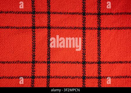 Closeup wool fabric showing black checkered plaid square textile texture Stock Photo