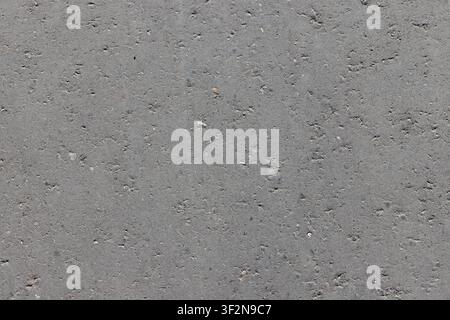 Flat gray asphalt texture showing close-up tarmac detail and uneven surface. Ideal background for road  construction and design projects and industria Stock Photo