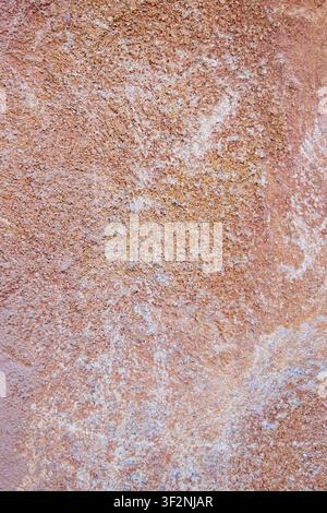 Rustic Terracotta Stucco Wall Texture Background with Weathered Rough Plaster Surface. Stock Photo