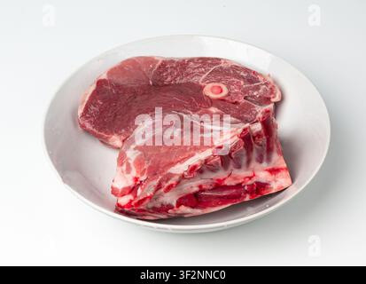Raw lamb rack isolated, fresh mutton fillet with ribs, tenderloin pieces, mutton rump sirloin meat, sheep chop fillet cut out, loin filet on white bac Stock Photo