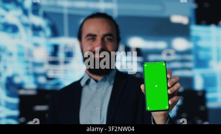 Business manager uses mockup screen next to AI neural networks, working with machine learning and cloud computing systems. Young man implementing artificial intelligence. Camera A. Stock Photo