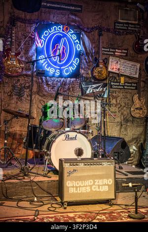Neon sign, drum kit and guitar amplifier onstage at Ground Zero Blues Club in Clarksdale, Mississippi. Stock Photo