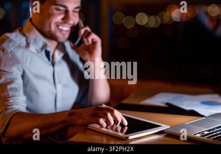 Businessman Using Digital Tablet Working Late At Night In Office Stock Photo