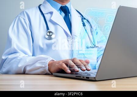 Doctor using laptop with AI medical dashboard and digital patient interface. Healthcare technology, electronic health records, diagnostics, telemedici Stock Photo