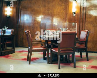 Vintage Art Deco dining room interior with displayed silverware onboard the historical ocean liner Hikawa Maru in Yokohama, Japan Stock Photo