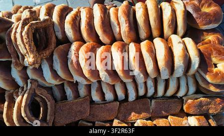 Bakers display different types of bread and pastries at a market Stock Photo