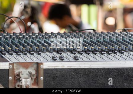 Professional audio mixing console with multiple channel controls for live sound production recording broadcasting and music performance technology Stock Photo