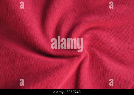Red fabric shows spiral texture and soft feel Stock Photo