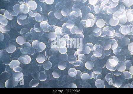 White bokeh circles on a silver abstract background for elegant design, festive branding and digital visuals Stock Photo