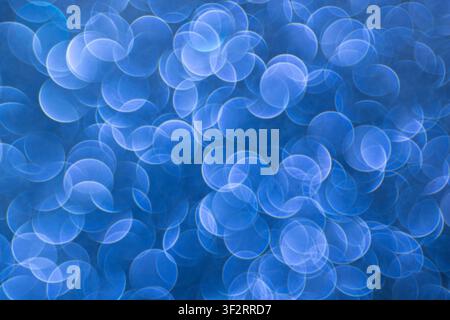 Soft blue bokeh on an abstract background for digital design, event screens and modern visuals Stock Photo