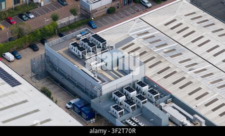 Aerial view of a large data center campus in Slough, showing HVAC systems, emergency backup power generators, cloud computing and massive digital infr Stock Photo